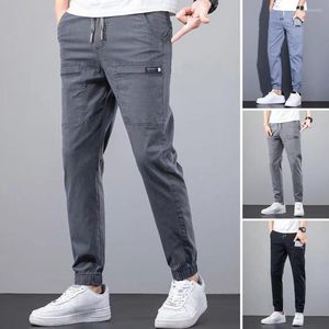 Herenbroek mannen vracht massief kleur multi -zakken denim broek herfst elastische taille slanke fit jeans midden drawstring