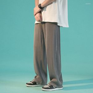 Pantalones para hombre, informales, con bolsillos plisados, ropa de moda para hombre, estilo de Hong Kong, con cremallera, pantalones de primavera, parte inferior suelta