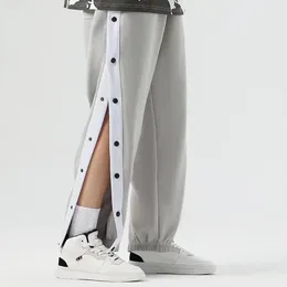 Pantalon pour hommes à dessin à la gamme de bouton latéral en vrac sport souffrant de pantalon de gym de gym respirant avec une jambe large pour le jogging