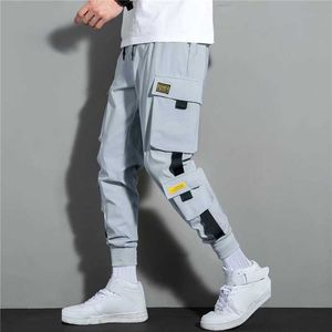 Men's Pants Bolsillos laterales para hombre Cargo Harem pantalones 2023 cintas negro Hip Hop Casual masculino Joggers pantalones moda Casual Streetwear pantalones Z0306