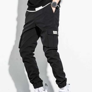 Pantalon masculin pour hommes de poche de poche pantalon harem avec un pantalon de jogger pour hommes décontractés en ruban noir à la mode dans un grand sizel2404