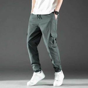 Pantalon masculin à la taille de la taille à la mode conception brossée pour hommes pantalon enveloppé de pantalons enveloppés de produits de datte à chaud poches y240522