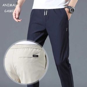 Pantalon masculin Nouveau pantalon décontracté pour hommes mince pantalon droit d'été pantalon sec rapide