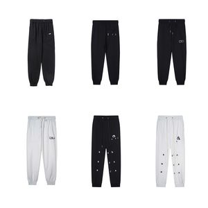 Pantalons pour hommes Nouveau pantalon à motif simple décontracté pantalon de sport à cordon ample pantalon de survêtement à neuf points hommes femmes