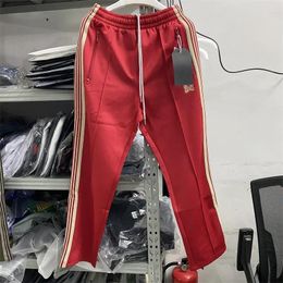 Pantalon pour hommes rouges verts awge aiguilles pantalons de survêtement hommes femmes qualité pantalon de papillon à rayures étroites