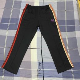 Pantalons pour hommes ruban de contraste rouge AWGE aiguilles pantalons de survêtement brodés papillon pantalons pour hommes femmes vêtements