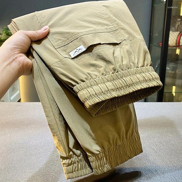 Pantalones de hombres con bandas retro con bandas de moda de moda de cosecha suelta Sports Pu Shuai Summer 2024 Casual Long