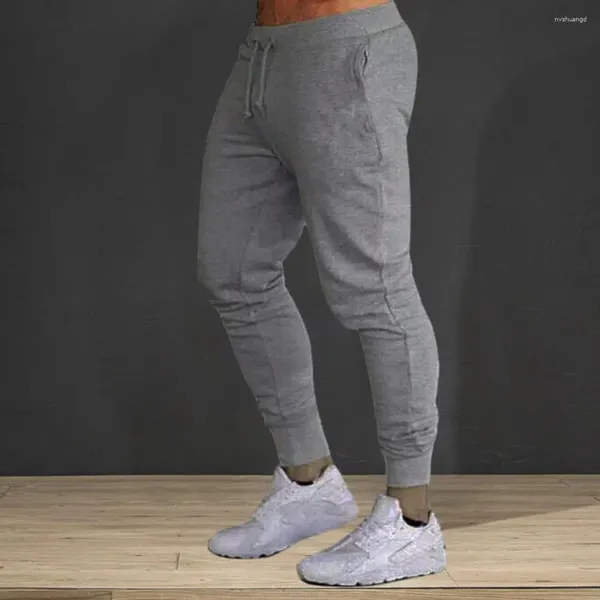 Pantalones de hombre Pantalones de chándal ajustados con cordón en la cintura Tela suave transpirable Diseño con banda en el tobillo para gimnasio Correr Sólido