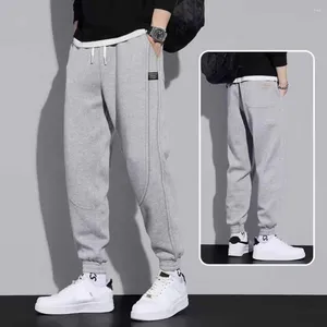 Pantalones deportivos para hombre, pantalones deportivos de secado rápido para correr, puños retráctiles, pantalones de chándal informales de Color sólido a la moda, ropa diaria