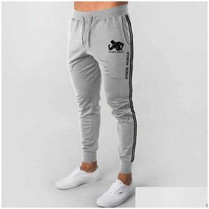 Pantalon masculin printemps et automne pour hommes de la mode Strongman sport dstring élastique pieds crayons fitness pantm-3xl y0811 drop de dhu3t