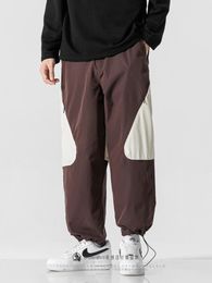 Pantalon pour hommes printemps et automne contraste de couleur rétro à la mode à crampons à la cheville liée à la cheville
