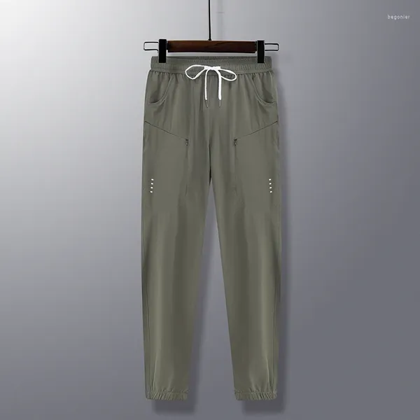 Pantalones para hombres primavera verano sólido bolsas de cintura elástica cremallera atada linterna casual harlan pantalones de carga de ropa dama