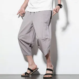 Pantalon pour hommes à rayures à rayures estivales recadrées avec un harem à imprimé vertical de taille élastique pour le streetwear
