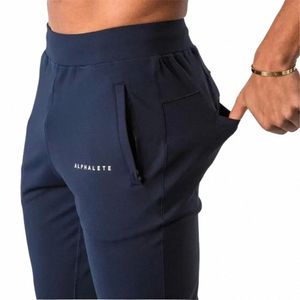 Pantalon de pantalons masculins Mentes Alphalete Brand Jogger Sweatpants Gyms Gyms Fitn Cott Colters masculins décontractés Fi Skinny Track 230131 Q5JY #