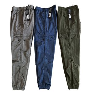 Herenbroeken Top lente en zomerkompas borduurwerk heren metaal nylon casual broek reflecterende metaal nylon broek voor mannen vrouwen 230425