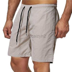 Shorts de taille plus masculine Summer des shorts décontractés masculins Couleur de bonbons capris à dix couleurs étanchées étanchées pantalon de plage rapide