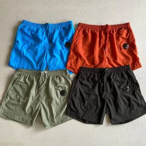 Pantalones cortos para hombres Verano Juventud Ocio al aire libre Deportes Nylon Pantalones de playa sueltos Quinto