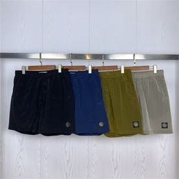 Pantalones cortos para hombres pantalones cortos deportivos clásicos de color sólido simple y transpirable nylon seco 5/10 pantalones estiramientos casuales sueltos