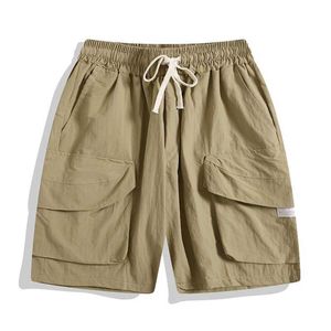 Heren shorts Japanse multi-pocket vrachtshorts zomer dunne snel drogende casual losse sport vijfpunts broek mannen bodem mannelijke sportkleding g240529