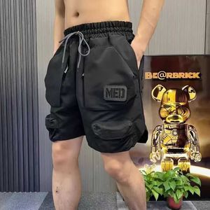 Heren shorts Grote pocket heren vracht shorts met zakken letters buiten sportfunctie Koreaanse luxe breed katoen grote en lange jogger y2k Q240520
