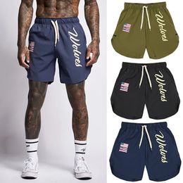 Shorts pour hommes Shorts de sport pour hommes Entraînement de basket-ball d'été européen et américain Tissé Pantalon à séchage rapide Pantalon décontracté à imprimé croisé 230707