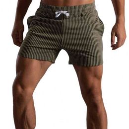 Shorts pour hommes Hommes Shorts rayé bonne élasticité taille élastique taille moyenne cordon de serrage été poches extensibles pantalons courts pour le sport T220517