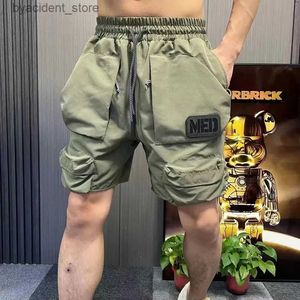 Shorts pour hommes Vêtements pour hommes Shorts d'été poche cinq-quarts pantalon Homme taille élastique pantalon Cargo Ins pantalons de plage Shorts de sport Homme coréen L240320