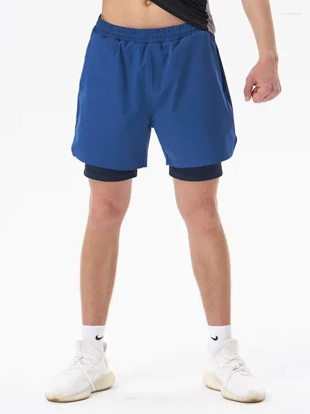 Pantalones cortos masculinos para hombres que corren los bolsillos para el ejercicio de la noche de fitness deportivo de fitness.