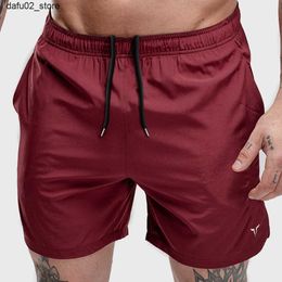 Shorts masculins Mentiers entraînement shorts de fitness respirant shorts de jogger respirant gymnase de corps bodybuild rapide secrèment sec short masculin rouge q240416