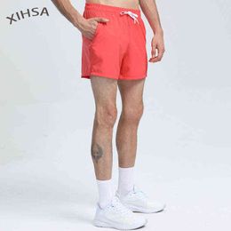 Heren shorts Sneldrogende driepunts shorts mannen nieuwste losse en ademende joggers trackshorts mannelijke trainingsbroek solide kleur strand shorts t220825