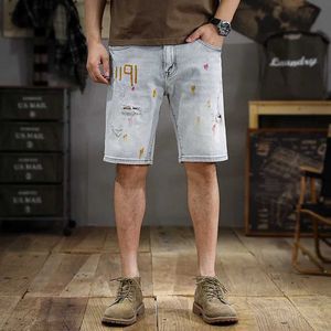 Heren shorts retro witte high-end denim shorts heren heren spatten inkt print ontwerp rechte shorts trend bijpassende scheurende shorts J240407