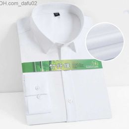 Pulls pour hommes S ~ 8XL Chemise blanche pour hommes en textile de bambou Robe pour hommes à manches longues élastique ultra-mince résistant aux plis adapté à la chemise formelle sociale Camisa Z230721