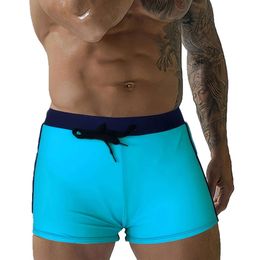 Swimwear masculin 2024 Nouvelle couleur unie à la taille à faible taille masculine à angle plat natation de plage short avec laçage