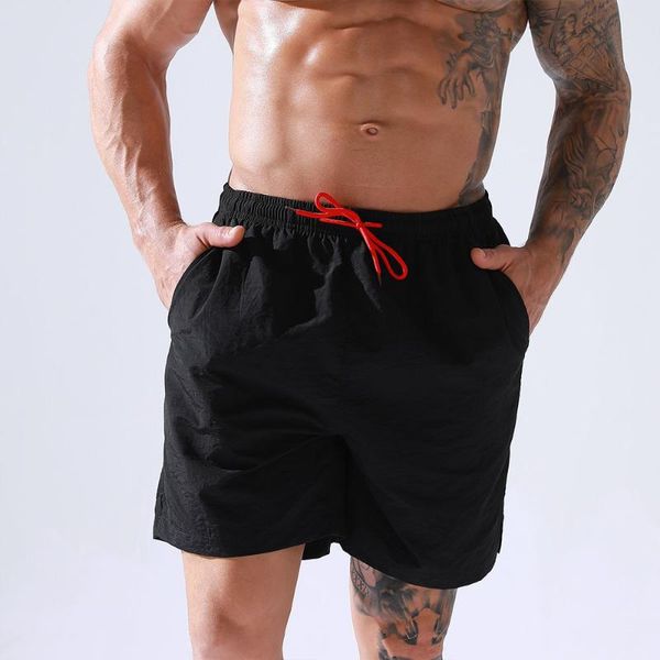 Traje de baño para hombre Pantalones cortos de verano Traje de baño sólido Hombres Casual Gay Surffing Ropa de playa con calzoncillos de baño de bolsillo