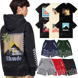 Camisetas para hombres Tamillas de diseñador de diseñadores para hombres Shorts Women Graphic Tees Tops Tops de manga corta Camiseta Hip Hop Letter Graffiti Impreso Rhude Pants