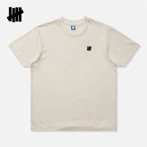 T-shirts pour hommes invaincu cinq barres printemps/été nouveau produit unisexe imprimé Simple coton T-shirt à manches courtes