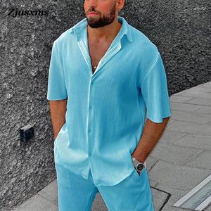 Tracksuits voor heren 2024 Men Solid eenvoudige tweedelige sets Summer Summer Short Sleeve Rapel Button Shirt Long Pants Beach Stripe Outfits