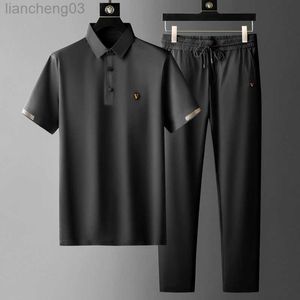 Chándales de hombre Negro Verano Nuevos conjuntos de hombre Azul oscuro Delgado Traje de secado rápido Polo casual Pantalones sueltos elásticos Moda Conjunto de 2 piezas W0328