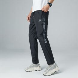 Pantalons de Sport pour hommes pantalons de course avec poches zippées entraînement de Football pantalons de Sport Fitness Leggings de Football pantalons de survêtement