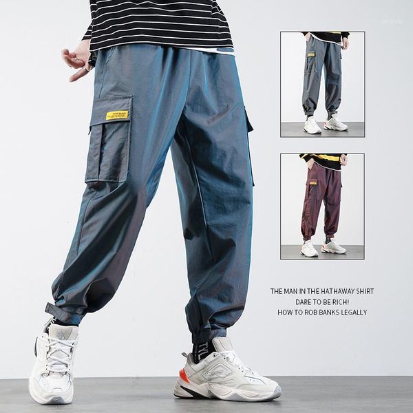 Hombres Streetwear Pantalones reflectantes Joggers 2021 Hombre Moda coreana Hip Hop Sweetpants Pareja Pantalones de rayas laterales Pantalones de gran tamaño