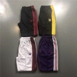 Uomo Donna Pantaloni sportivi Aghi Pantaloni AWGE Autunno Inverno Nuovi pantaloni con nastro ricamato a farfalla Colori stile Pantaloni AWGE276C