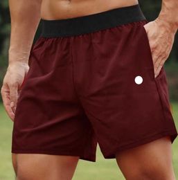Hommes Yoga Shorts de sport Fitness en plein air Séchage rapide Couleur unie Casual Running Quarter Pant Nouveau style populaire