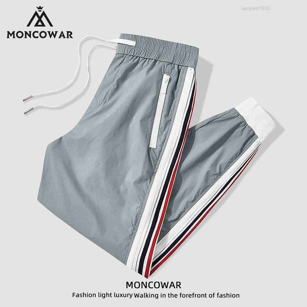 Mengkou batalha primavera e outono luz luxo grande marca calças casuais masculinas na moda marca high end listra solta esportes guarda calças masculinas