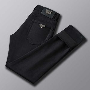 MENS 2023 Jeans édition coréenne slim slim small small pieds haut de gamme luxe noir pantalon long pantalon d'automne et d'hiver