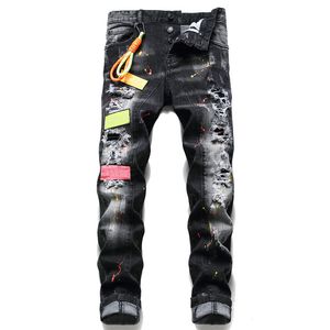 Men Badge Rips Stretch Jeans negros Fashion Fit Slim Motociclo Motociclo Pantalones de mezclilla para hombres Pantalones de hip hop para hombres 1070