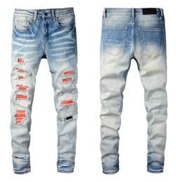 Herenblauwe spijkerbroek voor jongens knie gescheurde slanke fit magere man gescheurde broek oranje vlekken dragen fietser denim licht rek motorfiets mannelijke rip trendy lange rechte ritssluiting