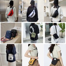 Bolso deportivo de marca para hombre, bolso de hombro para mujer, bolsa para teléfono móvil de nailon, bolsos de hombro para hombre, carteras para niños, bolsos neutros