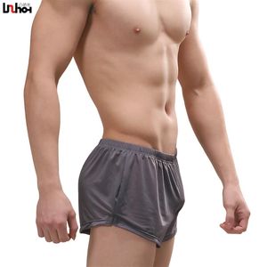 Boxers informales para hombre, pantalones cortos, bragas de seda de hielo transpirables de alta calidad, ropa interior sexi con bolsa para pene para hombre, ropa interior de talla grande XXL304E