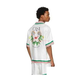 Chemises décontractées pour hommes Casa Designer Vêtements de mode Survêtements Dropped Satin Casablanca Style Chemise Tennis Fleur Lâche Femmes Polyvalent Dhhnv
