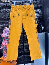 Jeans de créateurs pour hommes jeans de marque tendance pour les femmes mode Hombre Letter Star Men Perles imprimées Patchwork Ripped for Motorcycle Yellow Pant Mens Skinny